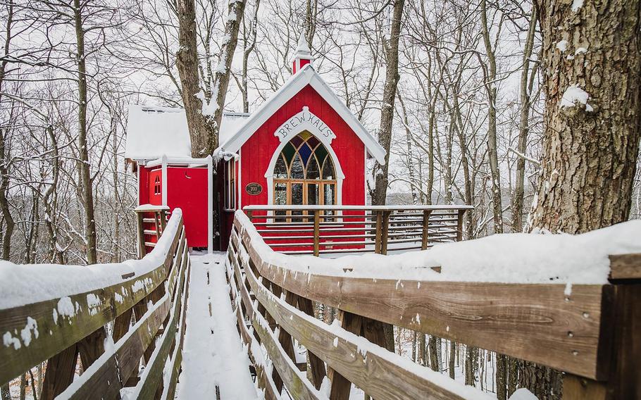 This undated photo provided by The Mohicans Treehouse Resort and Wedding Venue shows "Little Red" at The Mohicans Treehouse Resort and Wedding Venue in Glenmont, Ohio. Treehouses at this resort have heat and air conditioning and a full kitchen. 