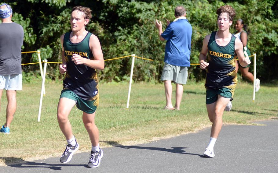Isaac French and Aidan Lehner run.