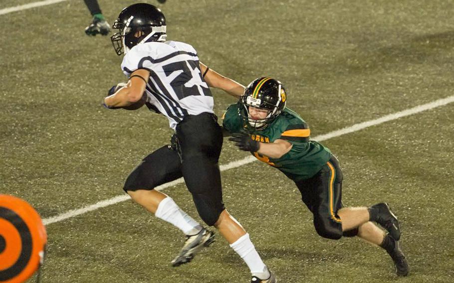 Zama's Kearney Araki tries to outrun Robert D. Edgren's Daniel Phillips.