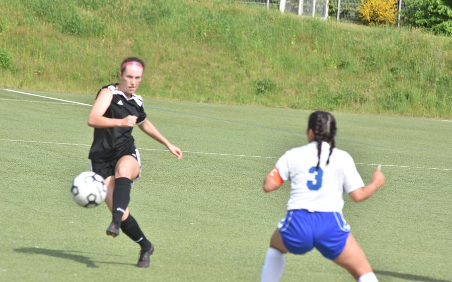 Vicenza's Riley West takes a shot while Rota's Michelle Vazquez-Santiago watches Tuesday, May 17, 2022, at the DODEA-Europe girls Division II soccer championships at Landstuhl, Germany.