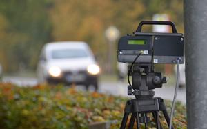 An automatic speed camera enforces the speed limit on a German roadside. Higher fines for speeding and illegal parking will take effect in Germany in November.