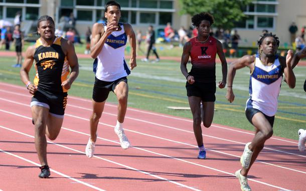 Kadena's D'Kylan Woods, Guam High's Jayden Jackson and Aaron Johnson and Nile C. Kinnick's Jaelin White dash for the finish in the 200 during Friday's Day 2 of the Far East track and field meet. Johnson and Woods placed 1-2.