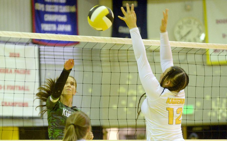 Kubasaki's Alice Baron spikes against Kadena's Malana Williams during Thursday's Okinawa volleyball match. The Dragons beat the Panthers in straight sets for the 11th time this season.