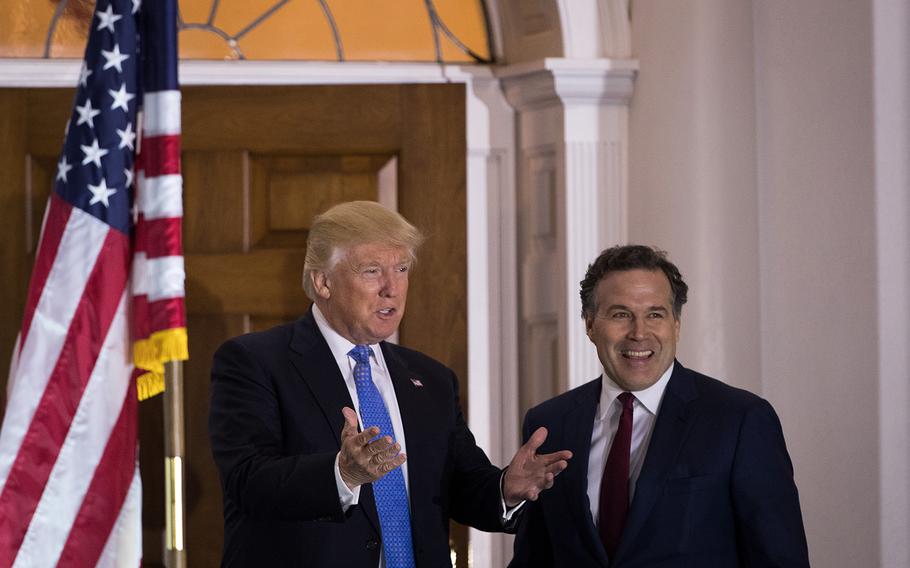 From left to right: President-elect Donald Trump and David McCormick, president of the management committee at Bridgewater Associates, pose for a photo before their meeting at Trump International Golf Club, Nov. 20, 2016, in Bedminster Township, N.J.