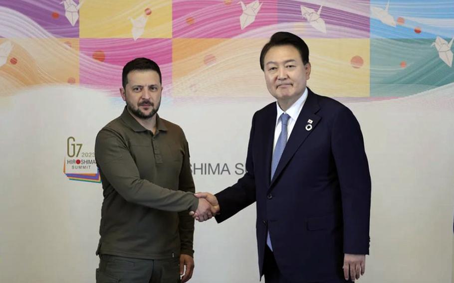 South Korean President Yoon Suk Yeol and Ukrainian President Volodymyr Zelenskyy pose during the Group of Seven summit in Hiroshima, Japan, May 21, 2023. 