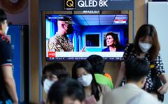 A TV screen shows a news program reporting about U.S. House Speaker Nancy Pelosi was visiting the Joint Security Area of the inter-Korean truce village of Panmunjom, at the Seoul Railway Station in Seoul, South Korea.