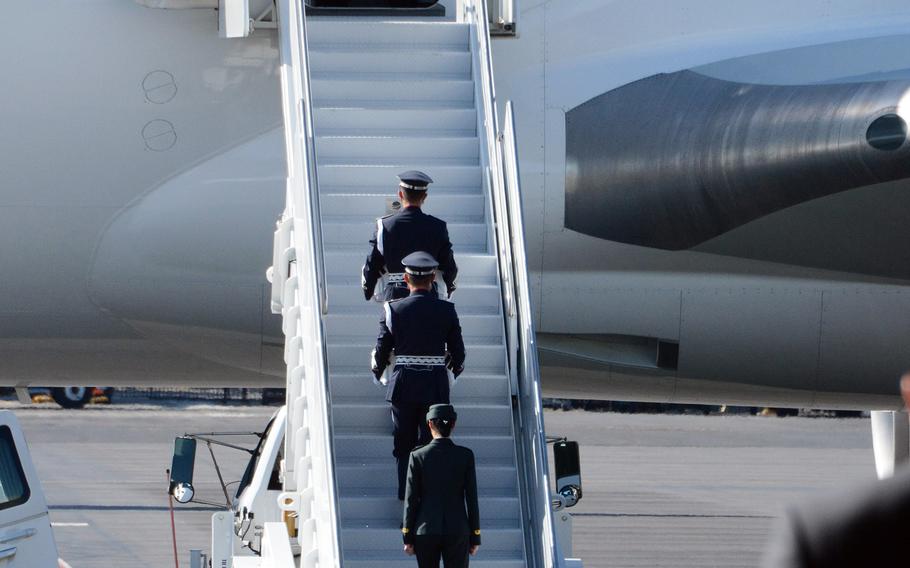 Remains of South Korean soldiers killed in the Korean War are carried onto a jet for a flight to their homeland during a repatriation ceremony at Joint Base Pearl Harbor-Hickam, Hawaii, Wednesday, Sept. 22, 2021.