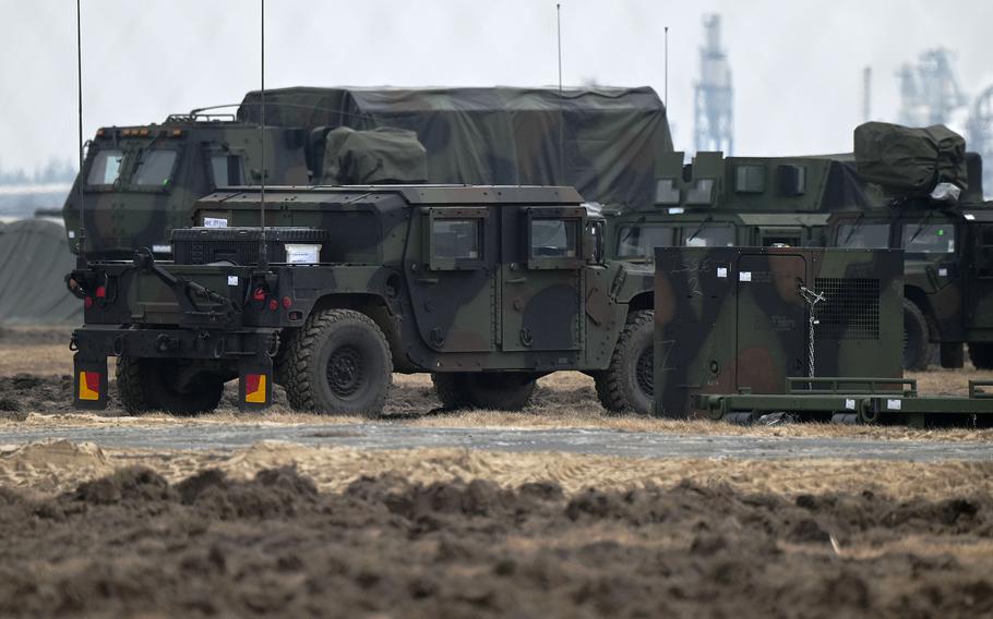 U.S. Army vehicles parked on an airfield on the outskirts of Mielec, Poland, Feb. 26, 2022.