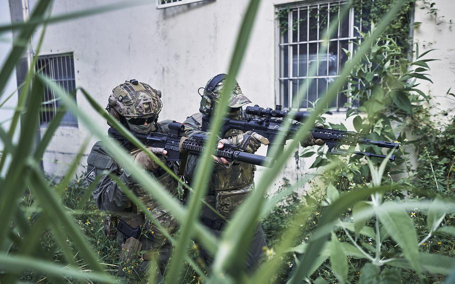 High school students Liao Hong-yu, left, and Chen Yi Hsiang demonstrate the skills they learned during combat and survival training with National Defense Education Training in Hualien, Taiwan. 