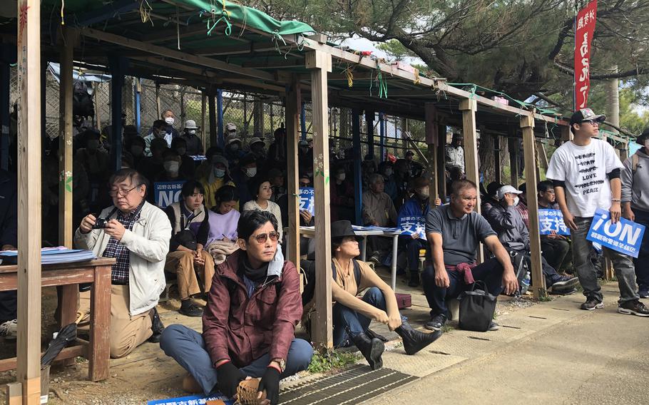 Protesters gather outside Camp Schwab, Okinawa, Friday, Jan. 12, 2024, following the restart of construction for a runway being built into Oura Bay.