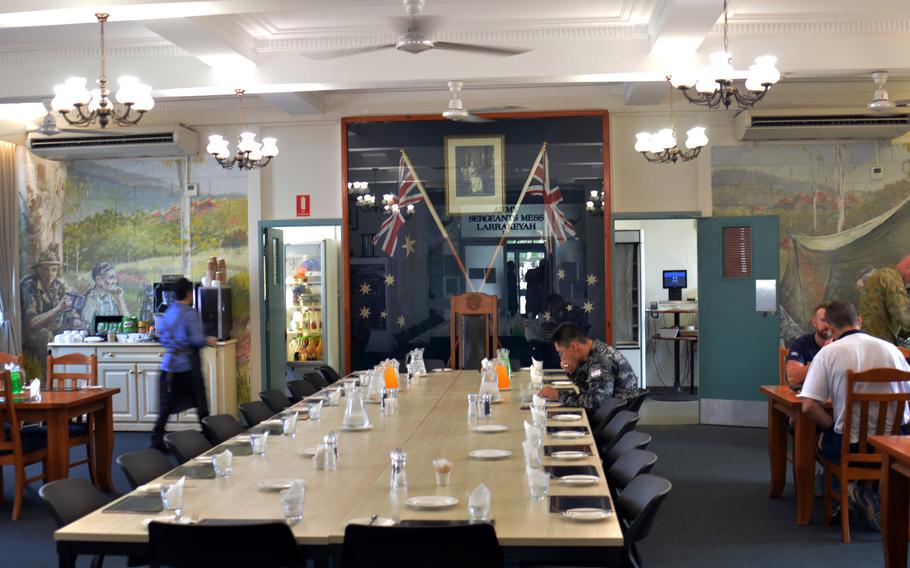 Troops eat beneath a portrait of Queen Elizabeth II in a dining facility that also service U.S. Marines at Larrakeyah Defence Precinct in Darwin, Australia. 