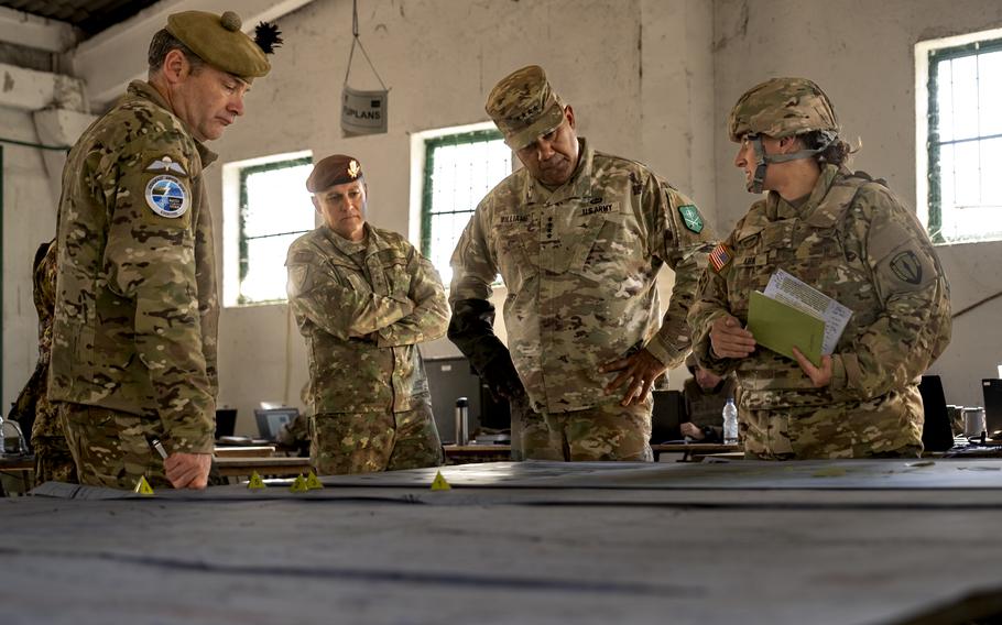 U.S. Army Maj. Aimee Kirk, with NATO’s Allied Rapid Reaction Corps, briefs Gen. Darryl A. Williams, Allied Land Command and U.S. Army Europe and Africa commanding general, during exercise Steadfast Jupiter 2023 in Romania. 