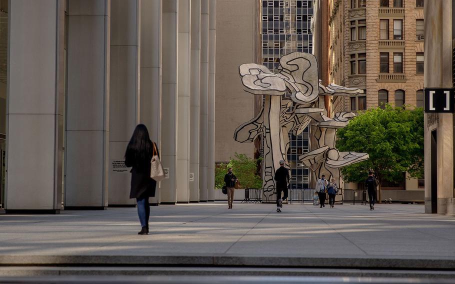 Pedestrians in the Financial District of New York on May 12, 2021. After more than a year of remote work and scattered employees, several of New York’s banks are gearing up to bring throngs of young people into the office over the coming weeks.