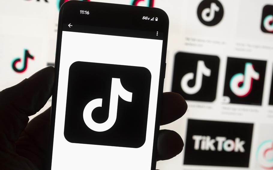 The TikTok logo is seen on a cell phone on Oct. 14, 2022, in Boston. The White House is giving all federal agencies 30 days to wipe TikTok off all government devices, as the Chinese-owned social media app comes under increasing scrutiny in Washington over security concerns.