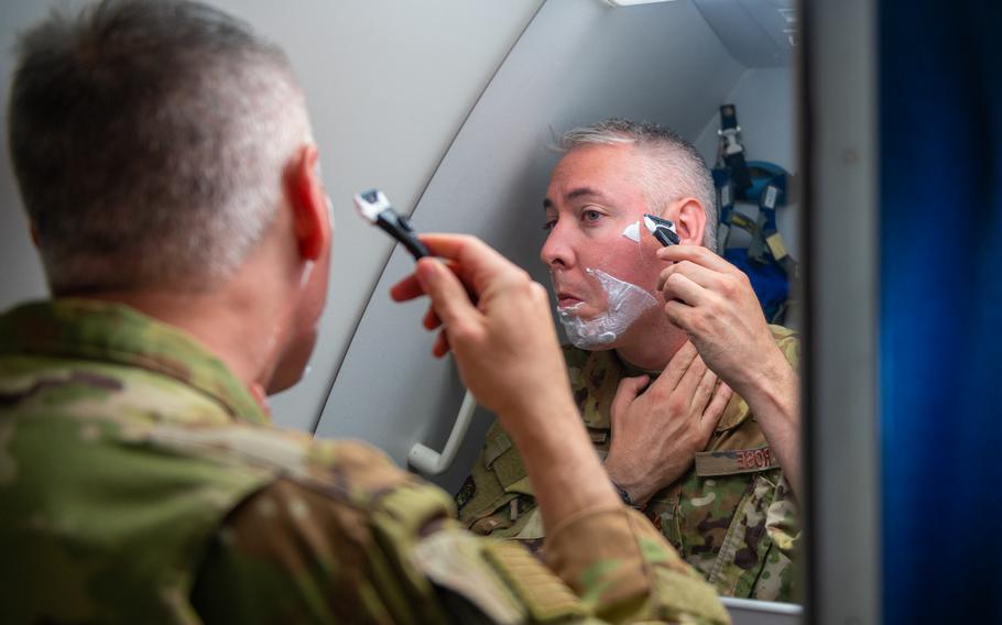 Maj. Kevin Rose, 349th Air Refueling Squadron instructor pilot, shaves during a 24-hour sortie, May 6, 2022. A new update to the Air Force’s dress and appearance regulations maintains that beards only are authorized for medical reasons.