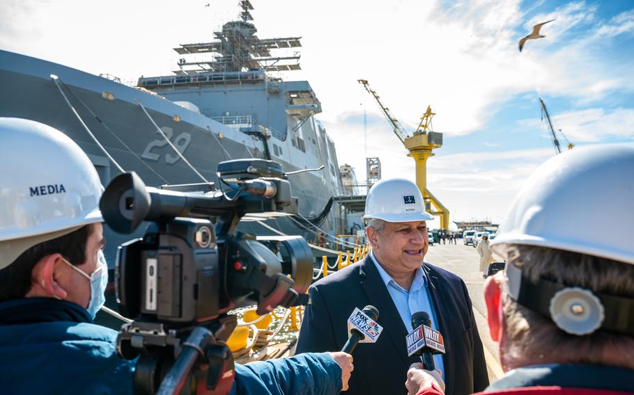 Navy Secretary Carlos Del Toro speaks to reporters during a shipyard tour at Ingalls Shipbuilding in Pascagoula, Miss., Jan. 26, 2022. The Navy’s strategy to rapidly divest itself of older vessels to make way for a larger, more lethal fleet is unrealistic, a recent congressional report and analysts suggest.