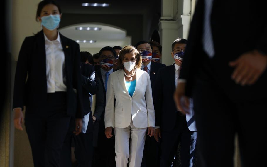 Nancy Pelosi, center, arrives at the Legislative Yuan in Taipei, Taiwan, in August 2022.