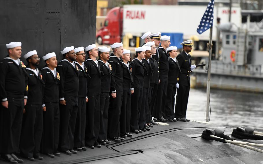 Sailors stand in formation