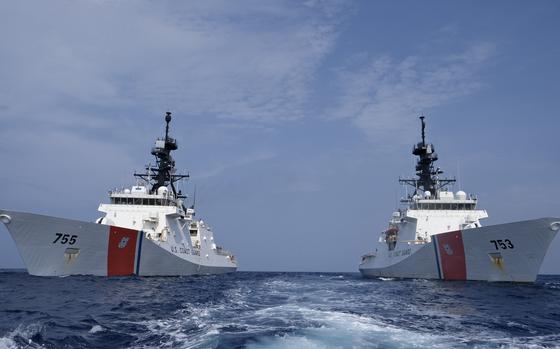 Crews from Coast Guard cutters Hamilton (WMSL 753) and Munro (WMSL 755) conduct at-sea training in the Pacific Ocean, March 12, 2024. Hamilton and Munro exchanged cutter boats and sailed in formation during this evolution. (U.S. Coast Guard photo by Ensign Ray Corniel)