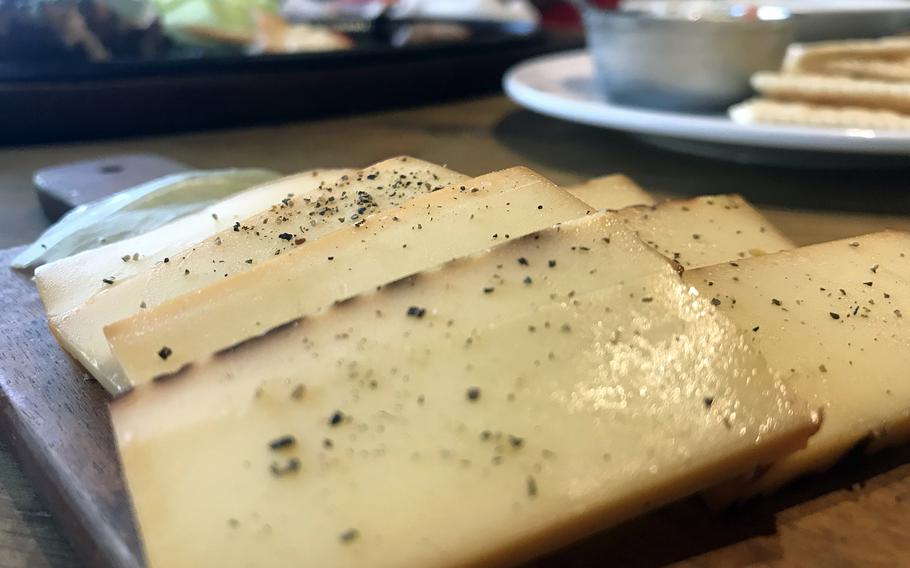 Smoked cheese is one of the many delicious appetizers offered at Panama Genjin Awase, an all-you-can-eat-and-drink eatery in Okinawa city. 