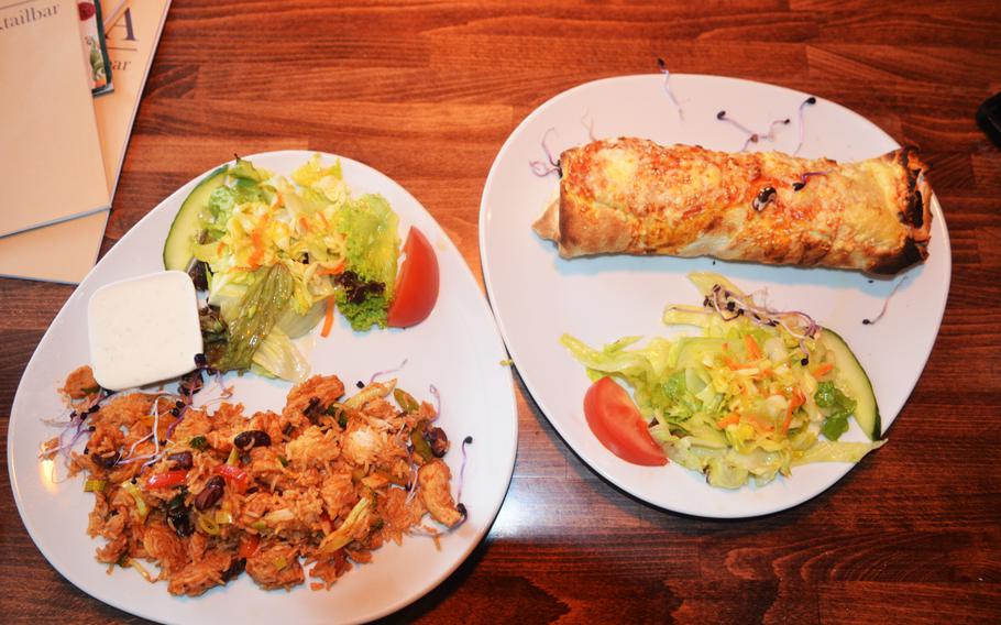 Havana Restaurant's arroz con pollo, left, and a rolla a la abuela, a fried burrito. The Wiesbaden, Germany, restaurant serves food inspired by multiple Latin American countries. 