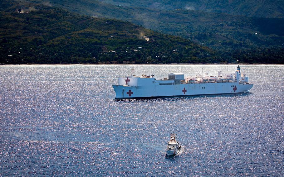 The hospital ship USNS Comfort (T-AH 20) anchors off the coast of Jeremie, Haiti, Dec. 12, 2022.