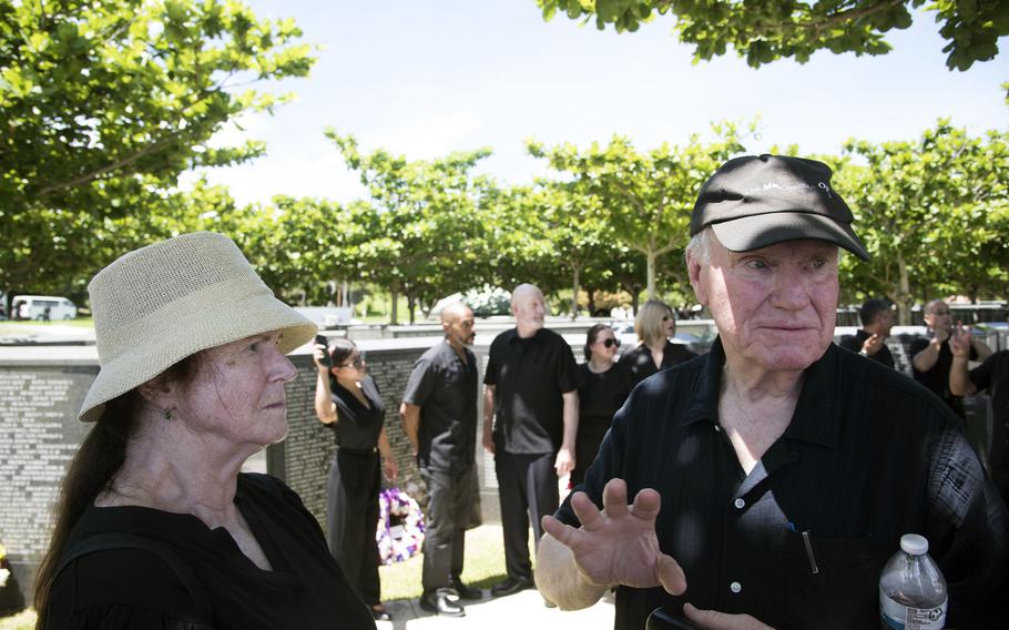 People gather for a memorial ceremony.