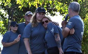 Gwendolyn Sanders, the widow of Staff Sgt. Charles "Chuck" Sanders, embraces Mikayla Degel at a memorial ceremony at Katterbach Kaserne in Germany on July 18, 2025. The ceremony commemorated 20 years since the crash of an Army CH-47 Chinook helicopter in Afghanistan killed all 18 people aboard, including Sanders' husband. 