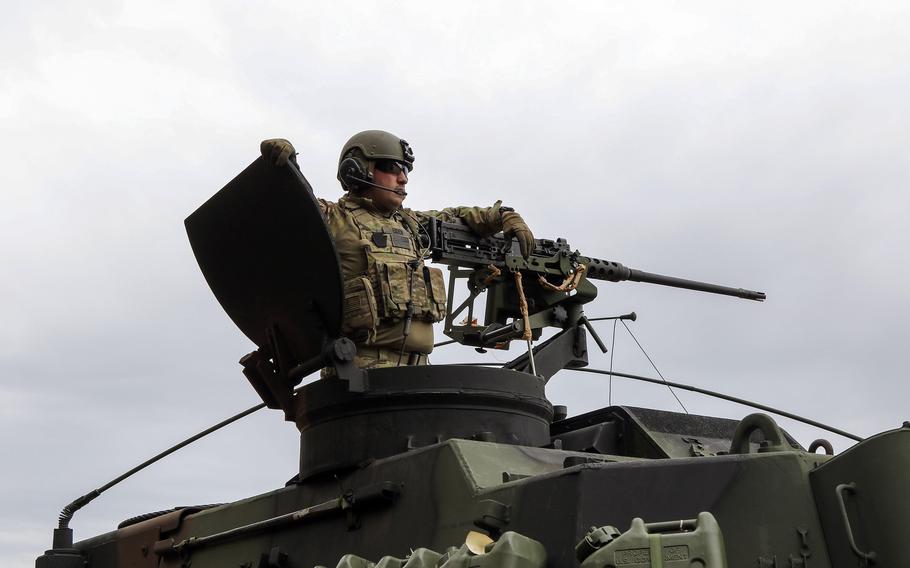 A Pennsylvania Army National Guard soldier mans a Paladin at an exercise May 16, 2022, in Pabrade, Lithuania. The Paladin was taken from pre-positioned stocks for the exercise. Initiatives on the table at the upcoming NATO summit in Madrid include more pre-positioned weaponry and air defenses.