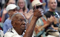 FILE - In this Sept. 12, 2019 file photo, World War II veteran Lawrence Brooks celebrates his 110th birthday at the National World War II Museum in New Orleans.  Brooks, the oldest World War II veteran in the U.S. — and believed to be the oldest man in the country — died on Wednesday, Jan. 5, ,2022 at the age of 112.  (AP Photo/Gerald Herbert, File)