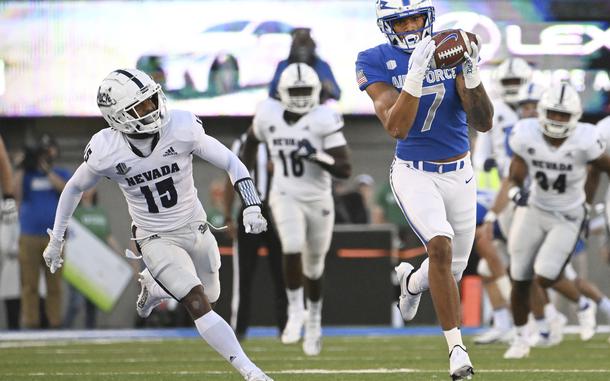 Air Force wide receiver David Cormiercatches a pass from quarterback Ben Brittain for a touchdown reception as Nevada defensive back Jaden Dedman defends during the first quarter of an NCAA college football game Friday, Sept. 23, 2022, in Air Force Academy, Colo.
