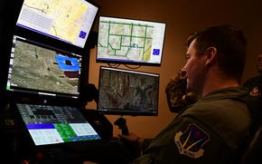 Members of the 926th Wing try the MQ-9 Reaper flight simulator during a tour of the 726th Operations Group at Creech Air Force Base, Nevada, February 27, 2025. The immersion focuses on the mission of the reservists who fly the MQ-9, a Remotely Piloted Aircraft with the primary mission of locating and destroying time-critical and highly mobile targets while also providing intelligence, surveillance and reconnaissance. The group toured the MQ-9 static display, the flight simulator and the air traffic control tower. (U.S. Air Force photo by Capt. Josephine Rios)