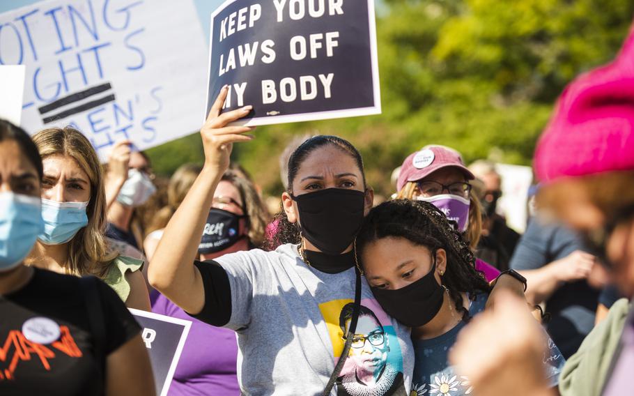 Emily Romero, 11, and her mother Gypsy Romero attend a rally in Freedom Plaza on Saturday as part of demonstrations across the country in support of abortion rights. 