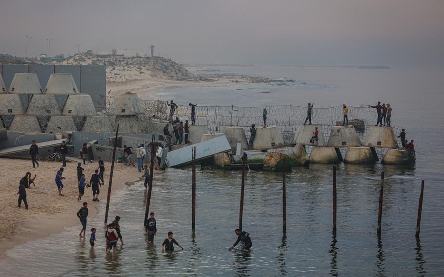 Palestinians on the beach in Rafah, near the border separating the Gaza Strip and Egypt, on Tuesday, Feb. 13, 2024. There are fears that an Israeli attack on Rafah will bury long-term peace efforts.