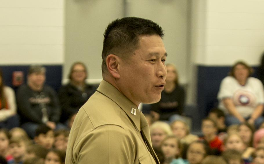 Grady Kurpas, shown during his time as a Marine, speaks to students during an assembly in Swansboro, N.C., Jan. 25, 2019. 
