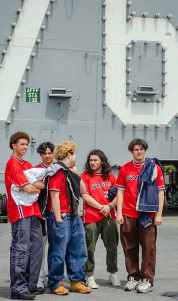 Seniors from Nile C. Kinnick High School tour the aircraft carrier USS Ronald Reagan at Yokosuka Naval Base, Japan, April 18, 2023.