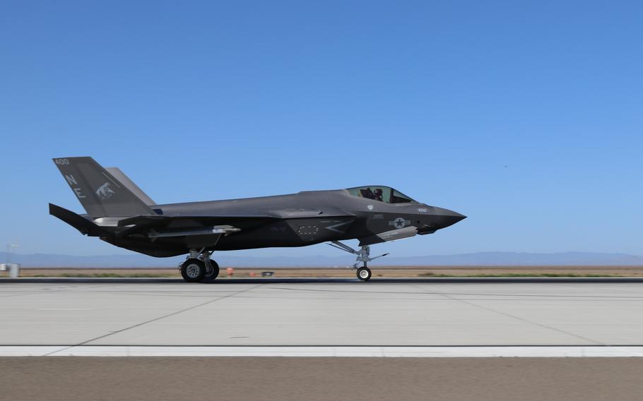 A fighter jet on the runway.