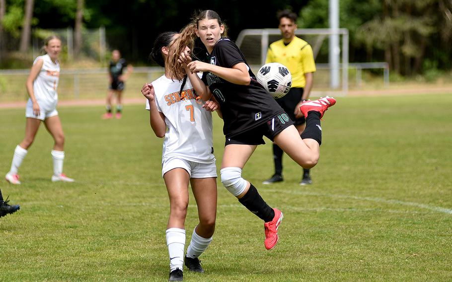 AFNORTH winger Clara Pacios backheels the ball ahead of Spangdahlem midfielder Rebecca Tremel during the second day of round-robin action at the 2025 Division III DODEA European championships on May 20, 2025, at Rothenborn Stadion in Landstuhl, Germany.