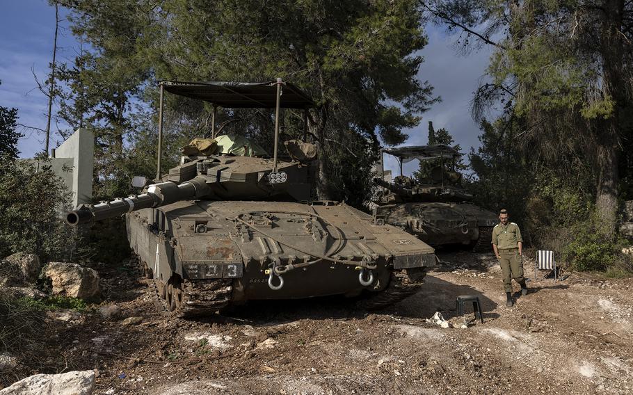 Ezra, an Israeli reservist soldier by his tank near the Israel-Lebanon border on Thursday, Jan. 4, 2023.