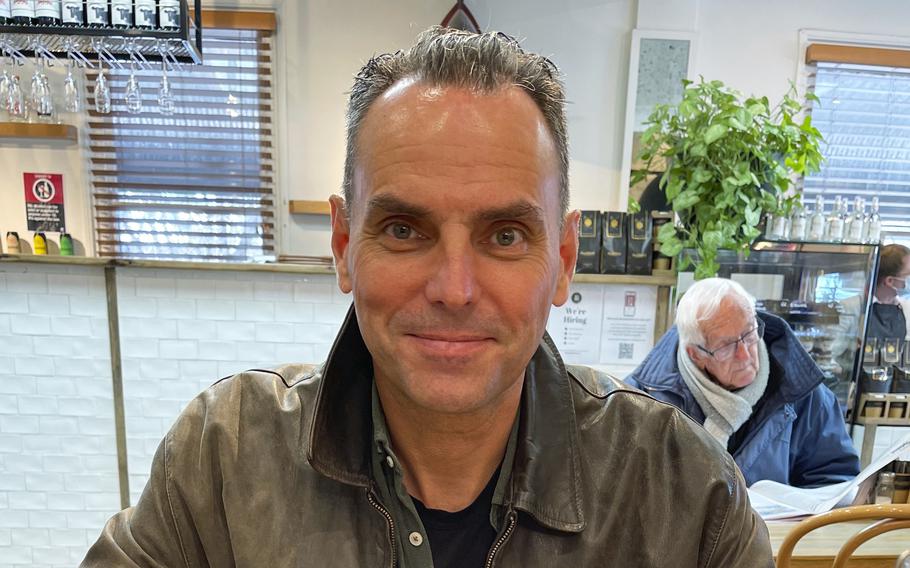 In this undated photo provided by Saffrine Duggan, her husband Dan Duggan poses for a photo in a restaurant. 