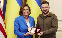 Ukrainian President Volodymyr Zelenskyy, right, awards the Order of Princess Olga to U.S. Speaker of the House Nancy Pelosi in Kyiv, Ukraine, Saturday, April 30, 2022. 