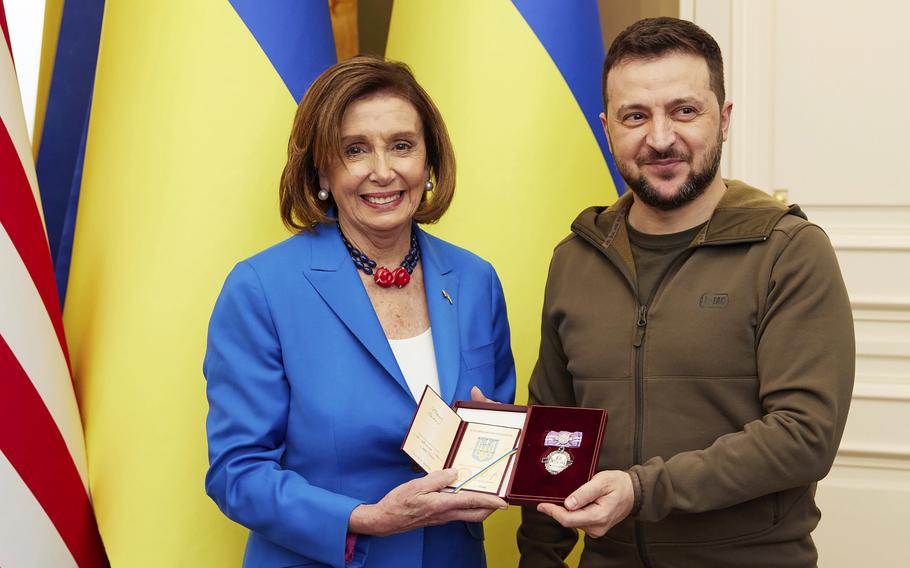 Ukrainian President Volodymyr Zelenskyy, right, awards the Order of Princess Olga to U.S. Speaker of the House Nancy Pelosi in Kyiv, Ukraine, Saturday, April 30, 2022. 
