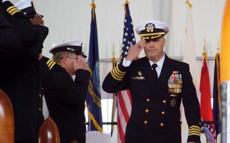 Capt. Justin Harts, the new commander of Destroyer Squadron 15, departs the change of command ceremony aboard the destroyer USS Higgins at Yokosuka Naval Base, Japan, on Nov. 17, 2023. 