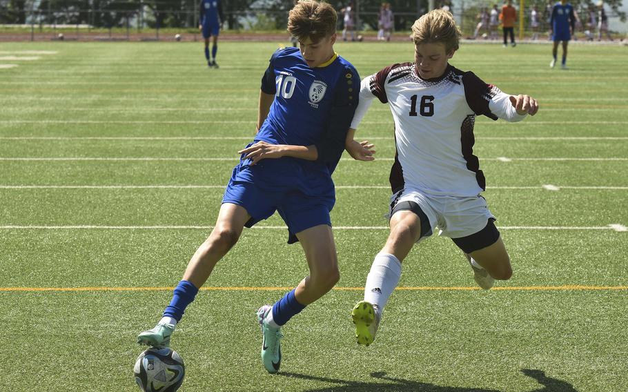 Wiesbaden sophomore Jaden Ruiz works the ball past Vilseck junior Chase Maverick during a game in Wiesbaden, Germany, on May 4, 2024. Ruiz scored a hat-trick during the game. 