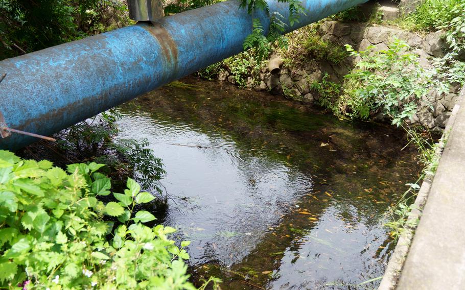 The Tate River flows under the Tachikawa Bridge near Naval Air Facility Atsugi, Japan, Friday, May 26, 2023.