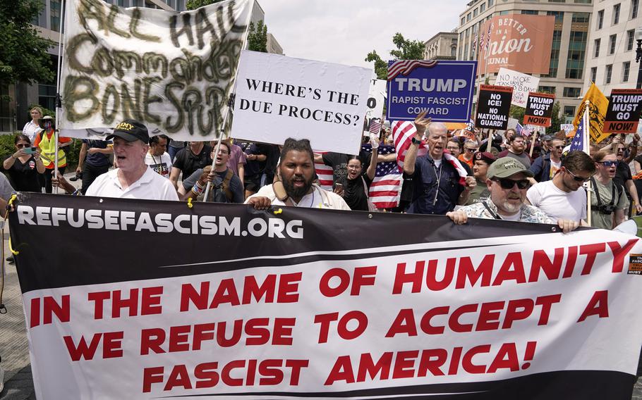 Demonstrators rally near Lafayette Park during a demonstration.