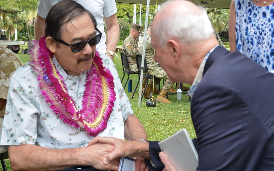 Dennis Fujii, left, speaks with retired Army Gen. David Bramlett before Fujii’s induction into the Gallery of Heroes at the Army Museum of Hawaii at Fort DeRussy on March 15, 2024.