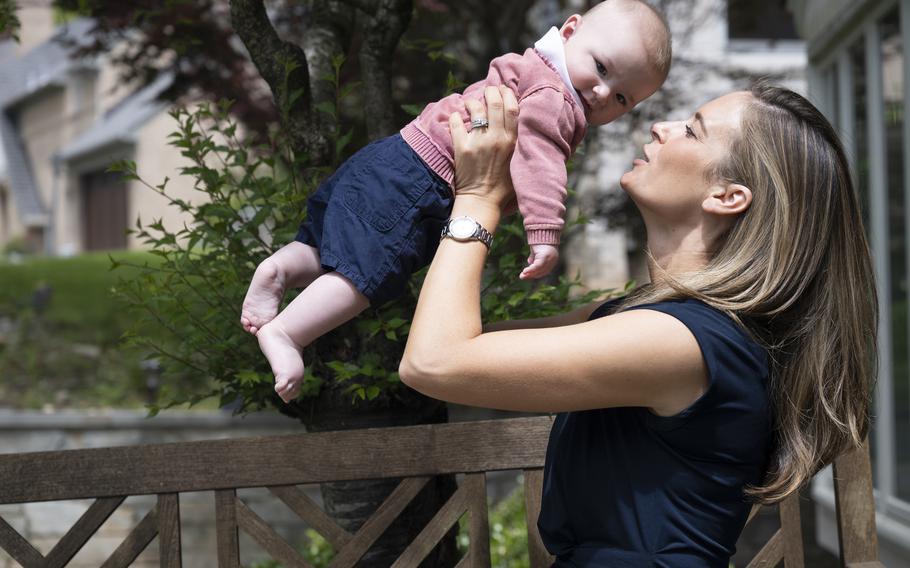 Lindsey Gill runs the The Napkin Network, which works with low-income families. Gill is searching for formula for families but also needs some for her 4-month-old son Dane, seen outside their home in Bethesda, Md., on Wednesday, May 11, 2022.