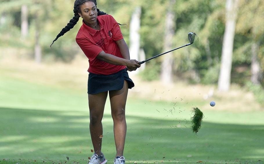 Kaiserslautern's Asia Andrews chips on the 18th hole at Woodlawn Golf Course during the second day of the DODEA European golf championships on Oct. 13, 2023, on Ramstein Air Base, Germany. Andrews collected her second consecutive crown and the Raiders' third straight individual title.