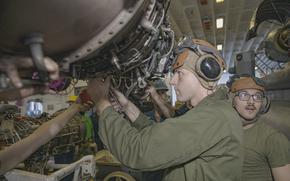  Cpl. Steven Adler adjusts bolts on an MV-22B engine on the USS Bataan on Feb. 9, 2020.